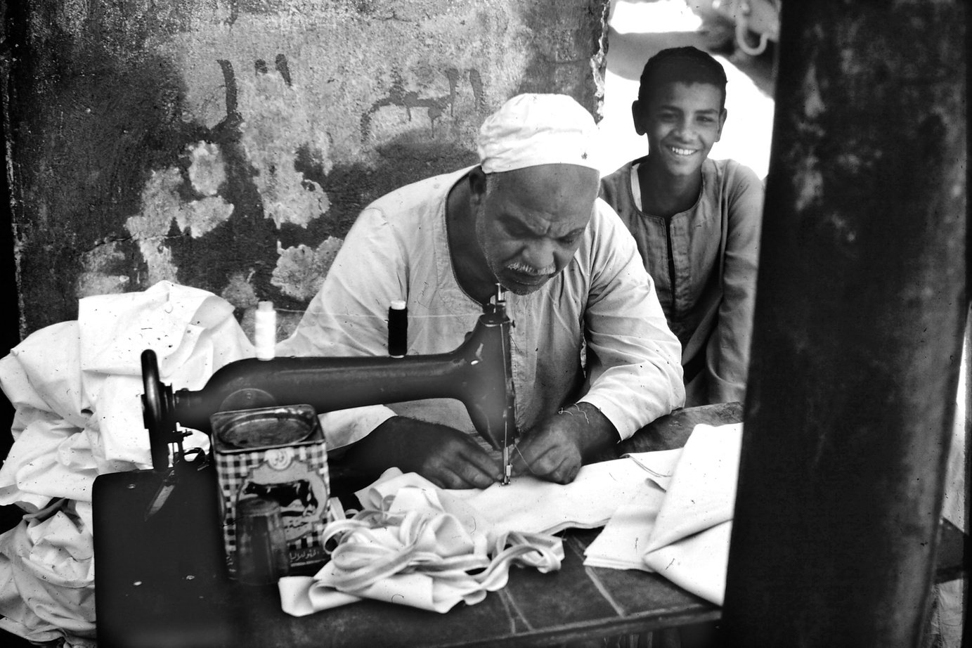 Person Sewing Cloth on Sewing Machine